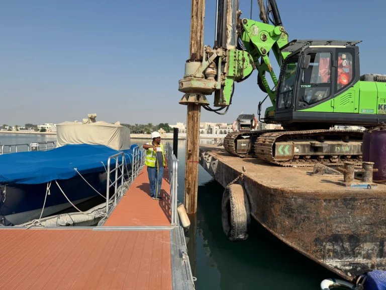 Marine pipeline installation with piling rig and crew alignment works at port