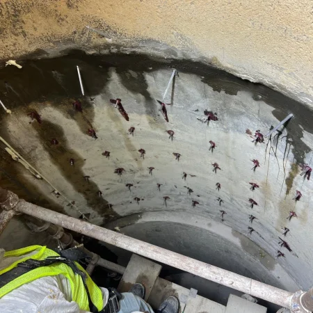Severe water leakage inside concrete sewer manhole before repair