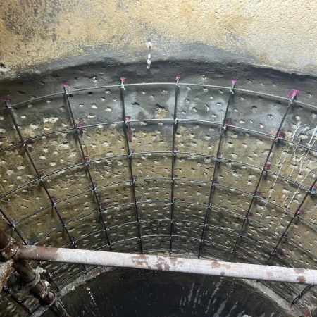 Steel reinforcement mesh installed inside circular manhole