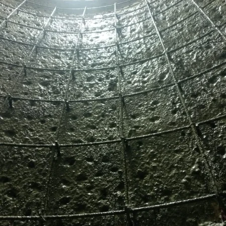 Chipped concrete wall prepared for strengthening works