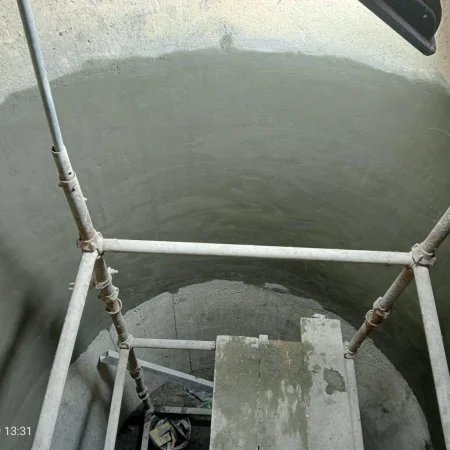 Completed internal concrete lining of sewer manhole